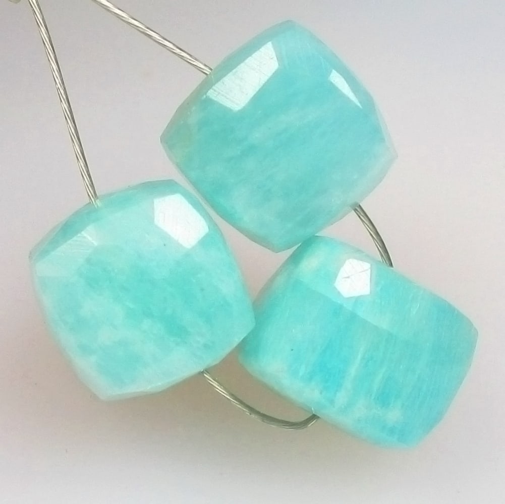 8.58 Ctw Natural 3 Drilled Amazonite Square Beads: No Reserve! Title: 8.58 Ctw Natural 3 Drilled Amazonite Square Beads Stone Clarity: Opaque Gemstones: Natural Amazonite Beads Carat Weights: 8.58 Size/Dimensions: 6.7x6.7 - 6.9x6.9 mm / 3 Pc's Additio