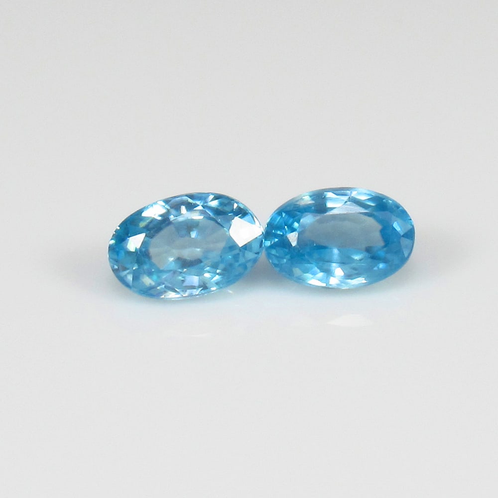 Natural Blue Zircon Pair - 1.36 Ct: No Reserve! Title: Natural Blue Zircon Pair - 1.36 Ct Origin: Combodia Weight: 1.36 Size/Dimensions: 6.0 x 4.0 x 3.1 mm Additional Information: Pieces : 2 No's / Shape : Oval Cut / Color : Blue / Clar