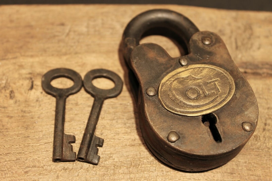 Colt Firearms Ammo Box Padlock Lock & Key: 3 3/4" tall x 2 1/8" Wide Nice reproduction cast iron Colt padlock! This lock is fully functional! Hard to tell its age. Heavy iron and brass. Great aged patina throughout. Limited quantity available!