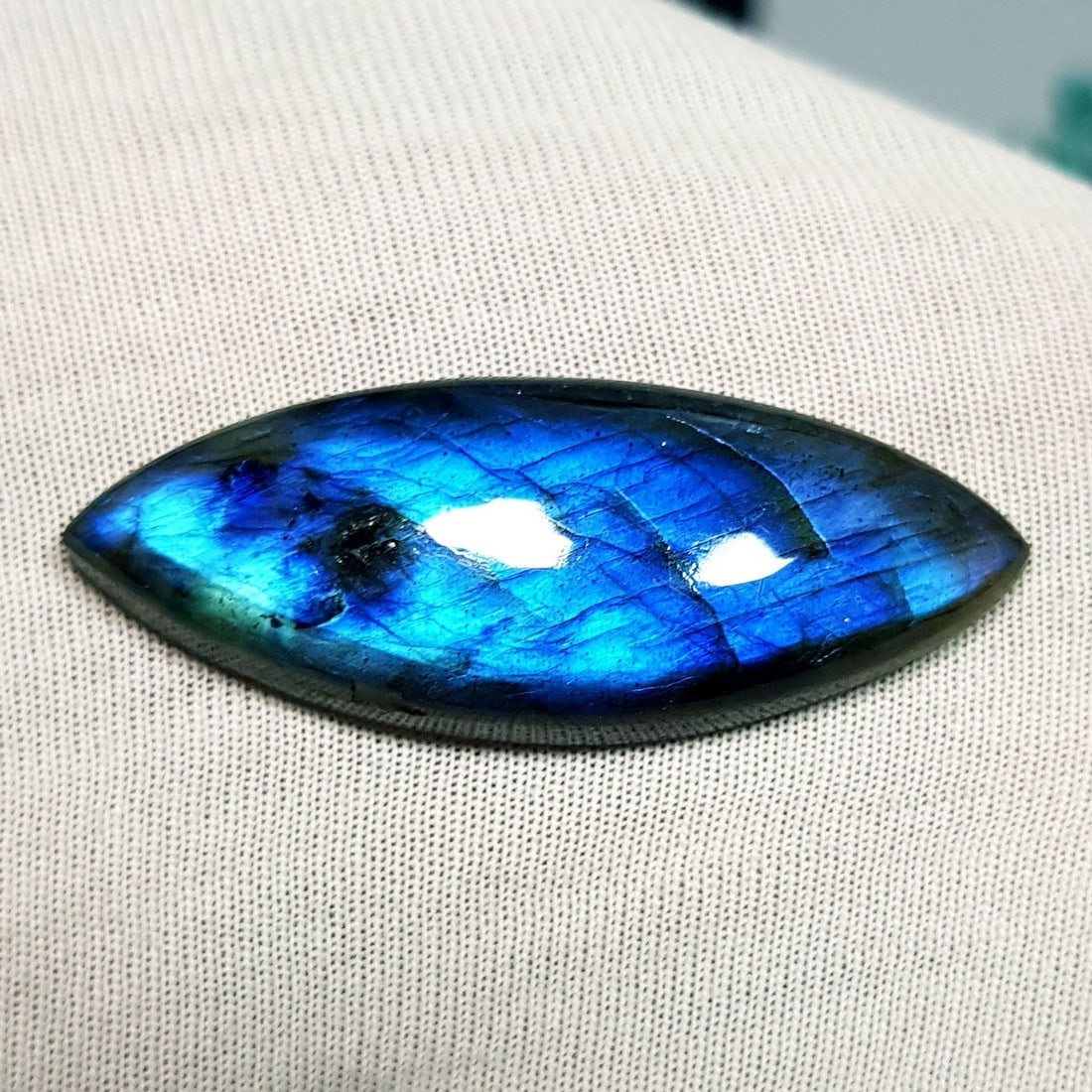 29.88 Ctz Natural Blue Labradorite: No Reserve! Title: 29.88 Ctz Natural Blue Labradorite Color/Clarity: Bluish / Semi Transparent Gemstone: Labradorite Carat Weights: 29.88 Size: 39.30 x 15.05 x 6.50 Additional Information: Maquise Cab