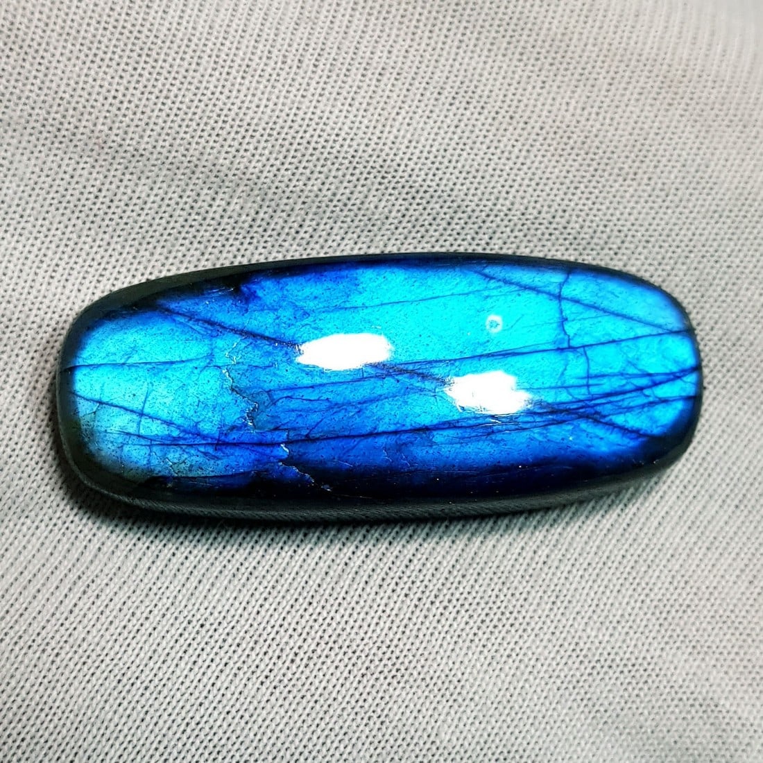 34.25 Ctz Natural Blue Labradorite: No Reserve! Title: 34.25 Ctz Natural Blue Labradorite Color/Clarity: Bluish / Semi Transparent Gemstone: Labradorite Carat Weights: 34.25 Size: 33.50 x 13.55 x 7.60 Additional Information: Rectangle C