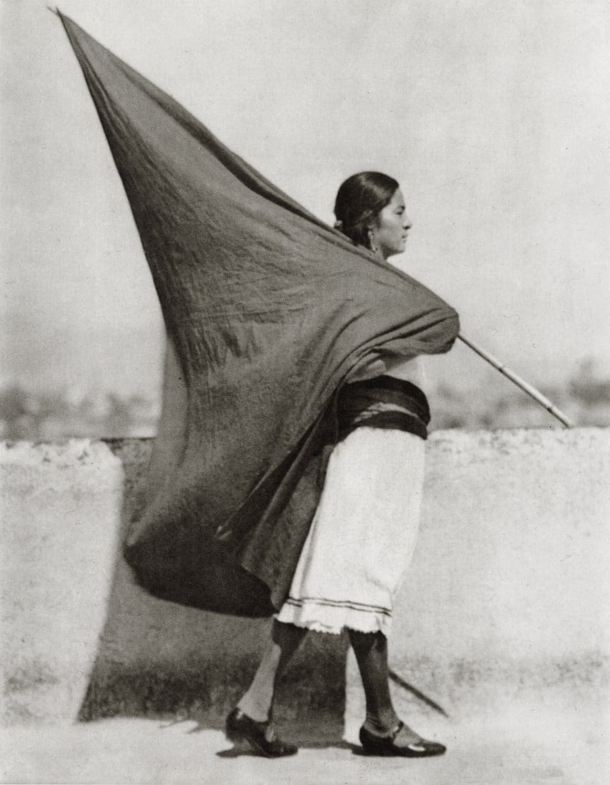 TINA MODOTTI - Woman with Flag, Mexico City, 1928: Artist: Tina Modotti Title: Woman with Flag, Mexico City, 1928 Medium: Photo Litho, 1999, China Dimensions: 5.65x7.25" Description: Heat Wax Mounted on 8.5x11" Conservation Board Artist Bio: Tina Modo