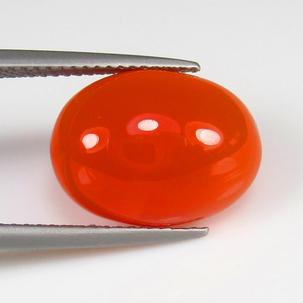 Natural Carnelian - 7.51 Ct: No Reserve! Title: Natural Carnelian - 7.51 Ct Origin: Brazil Weight: 7.51 Size/Dimensions: 15.0 x 11.0 x 6.0 mm Additional Information: Pieces : 1 No's / Shape : Oval Cab / Color : Orange / Clarity :