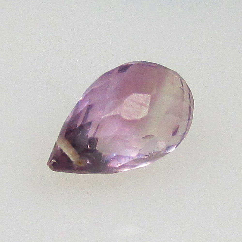 2.57 Ctw Natural Drilled Purple Amethyst Pear Drop Beads: No Reserve! Title: 2.57 Ctw Natural Drilled Purple Amethyst Pear Drop Beads Stone Clarity: Transparent Gemstones: Natural Amethyst Beads Carat Weights: 2.57 Size/Dimensions: 10.40 x 6.60 x 6.60 mm Add