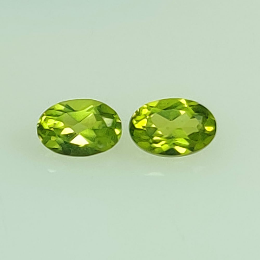 0.97 Ctw Natural Pakistan Peridot Oval Pair: No Reserve! Title: 0.97 Ctw Natural Pakistan Peridot Oval Pair Stone Clarity: VVS Gemstones: Natural Peridot Carat Weights: 0.97 Size/Dimensions: 5.90 x 4.10 x 2.80 mm / 2 Pc's Additional Information: