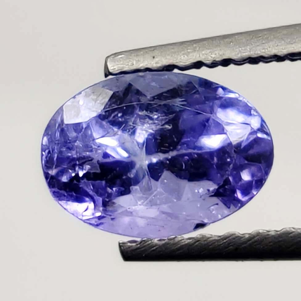 1.10 Ct "Good Quality" Natural Tanzanite: No Reserve! Title: 1.10 Ct "Good Quality" Natural Tanzanite Additional Information: Gemstones: Natural Tanzanite Carat Weights: 1.10 ct Size/Dimensions: 7 X 5 mm Origin : Tanzania Materials & Techniqu