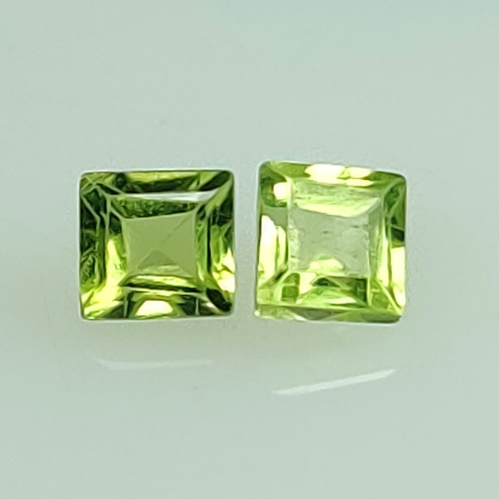 0.89 Ctw Natural Pakistan Peridot Square Pair: No Reserve! Title: 0.89 Ctw Natural Pakistan Peridot Square Pair Stone Clarity: VVS Gemstones: Natural Peridot Carat Weights: 0.89 Size/Dimensions: 4.00 x 3.80 x 2.90 mm / 2 Pc's Additional Informatio