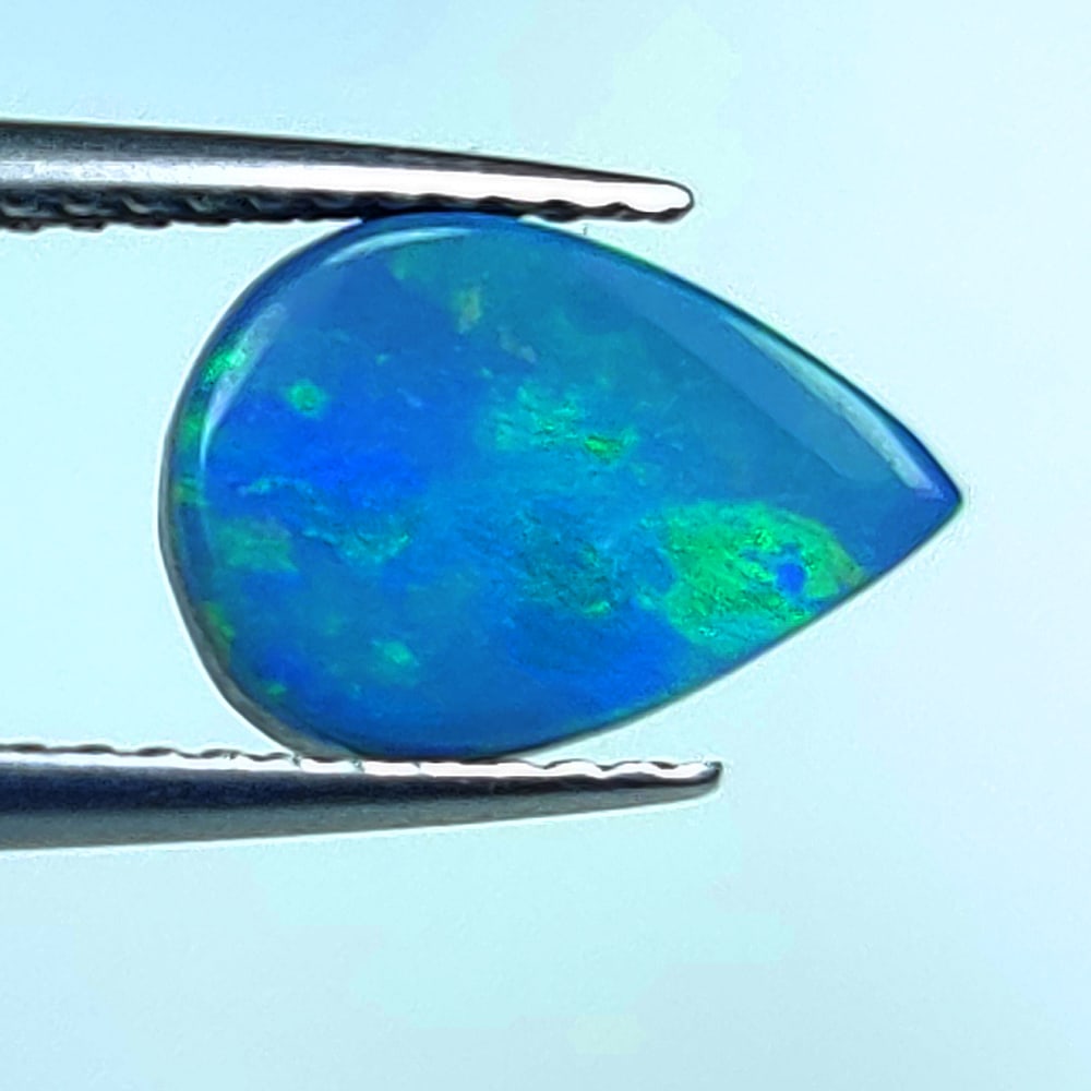1.92 Ctw Natural Australian Doublet Opal Pear Cabochon: No Reserve! Title: 1.92 Ctw Natural Australian Doublet Opal Pear Cabochon Stone Clarity: Opaque Gemstones: Natural Australian Opal Carat Weights: 1.92 Size/Dimensions: 10.50 x 7.40 x 3.00 mm Additiona