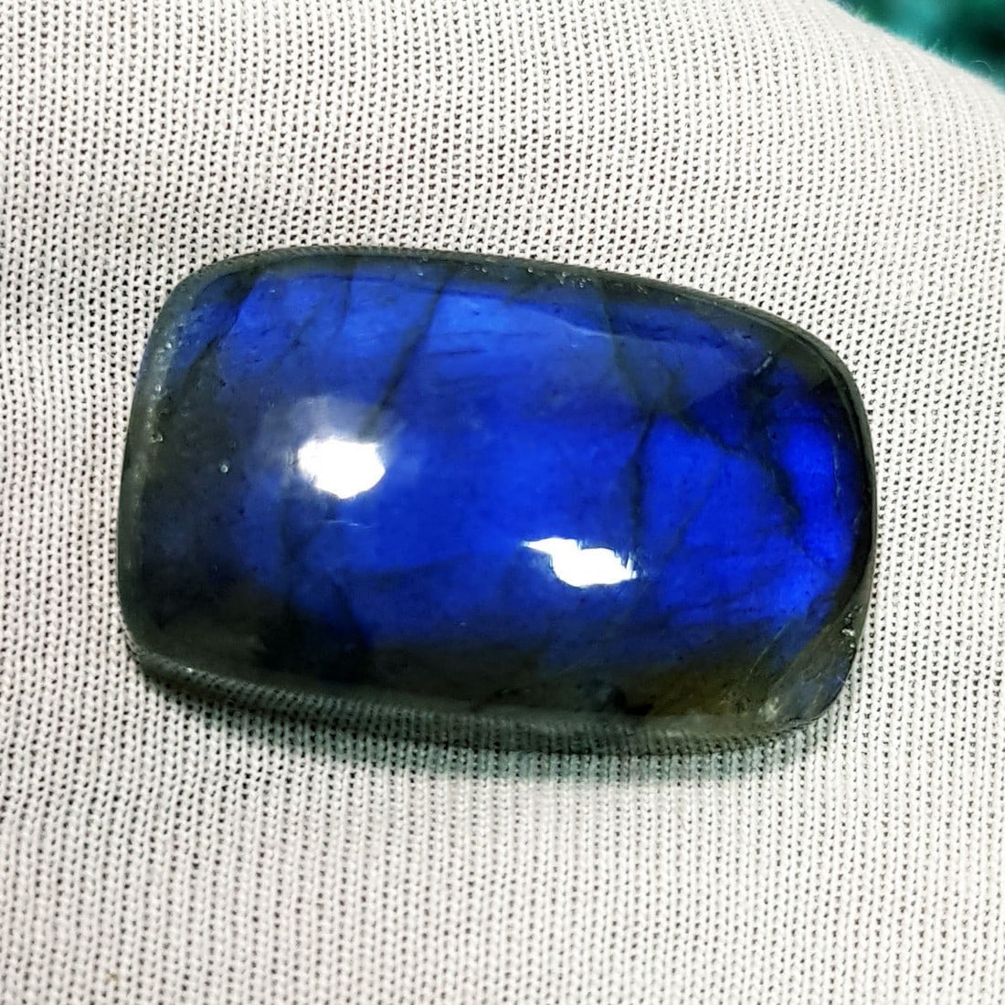 34.78 Ctz Natural Blue Labradorite: No Reserve! Title: 34.78 Ctz Natural Blue Labradorite Color/Clarity: Bluish / Semi Transparent Gemstone: Labradorite Carat Weights: 34.78 Size: 26.25 x 16.70 x 7.90 Additional Information: Octagon Cab