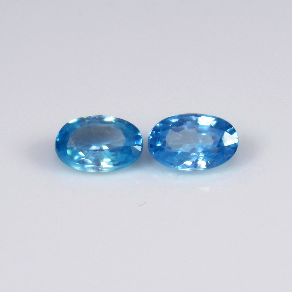 Natural Blue Zircon Pair - 1.36 Ct: No Reserve! Title: Natural Blue Zircon Pair - 1.36 Ct Origin: Combodia Weight: 1.36 Size/Dimensions: 6.0 x 3.8 x 2.4 mm Additional Information: Pieces : 2 No's / Shape : Oval Cut / Color : Blue / Clar
