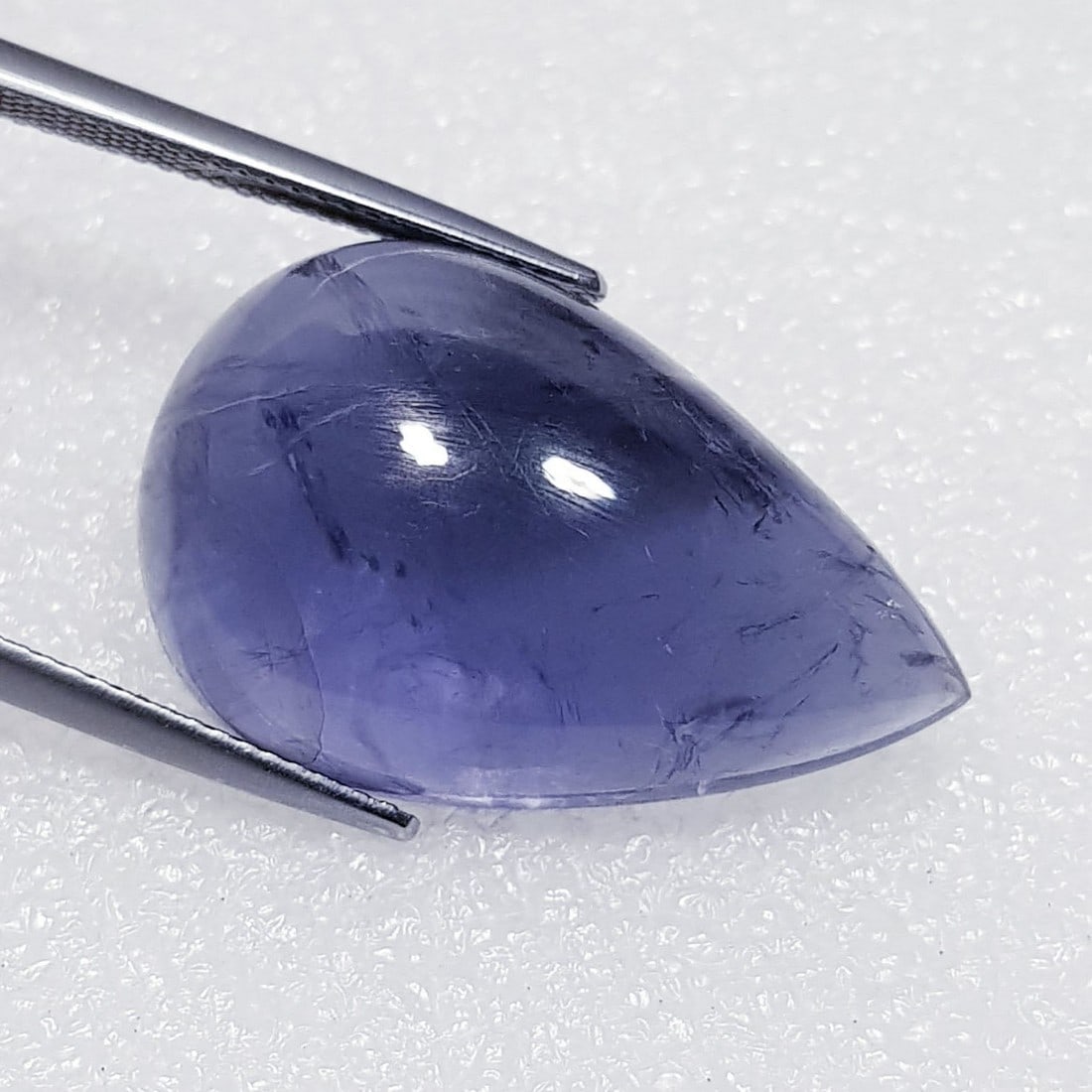 24.89 ctz Fine Collection of NaturalLCabochon Iolite: No Reserve! Title: 24.89 ctz Fine Collection of NaturalLCabochon Iolite Color/Clarity: Blue / VS Gemstone: Sapphire Carat Weights: 24.89 Size: 26.55 x 17.20 x 8.50 Additional Information: Pear Cabocho