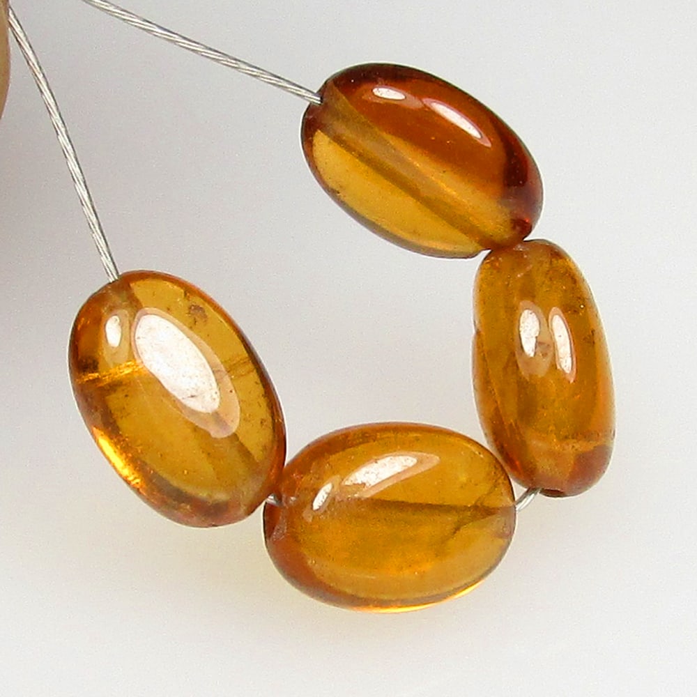 5.03 Ctw Natural 4 Hessonite Garnet Dumble Beads: No Reserve! Title: 5.03 Ctw Natural 4 Hessonite Garnet Dumble Beads Stone Clarity: Transparent Gemstones: Natural Hessonite Garnet Beads Carat Weights: 5.03 Size/Dimensions: 5.0x3.5- 5.3x3.7 mm / 4 Pc