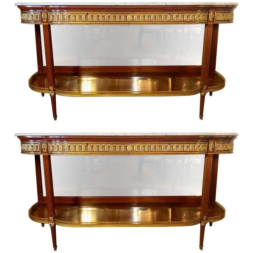 Pair of Louis XVI Jansen Style Console Tables or Sideboards: Title: Pair of Louis XVI Jansen Style Console Tables or Sideboards Description: A fine pair of Louis XVI Jansen style marble-top console tables or sideboards with bevel mirror back panels. This pair o
