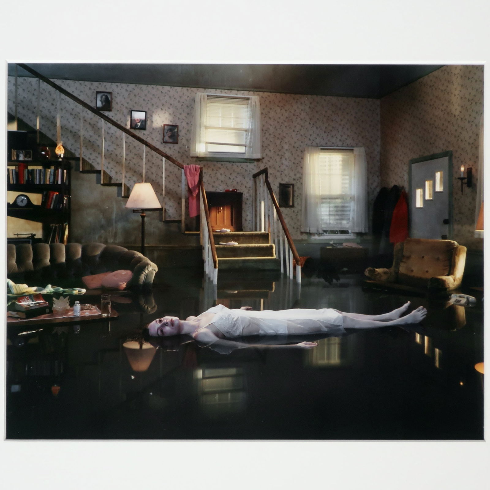 Gregory Crewdson “Untitled (Ophelia)” (2001): A framed print of Gregory Crewdson's "Untitled (Ophelia)" (2001) from the artist's acclaimed Twilight series. Twilight consists of forty photographs exploring the themes of alienation, loneliness, and
