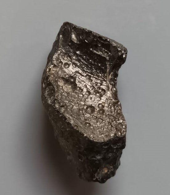 Philippinite Tektite - From Meteorite Impact: Title: Philippinite Tektite - From Meteorite Impact Origin: Anda, Cabarruyan Isl. Pangasinan, Luzon, Philippinines Size: 2x1.1x0.9 cm / 2.16 gram Description: small irregular shaped philippinite tekti