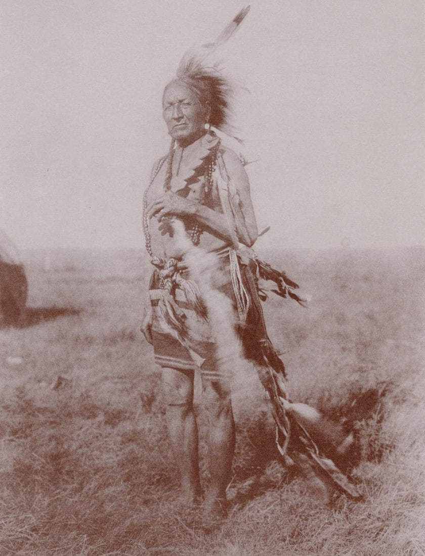 EDWARD CURTIS - Arapaho Warrior: Title: EDWARD CURTIS - Arapaho Warrior Description: Artist: EDWARD CURTIS Print Title: Arapaho Warrior Medium: Sheet-fed Gravure Printing Date: 1970's Printed in the USA Image Size approx: 9 x 7 inche