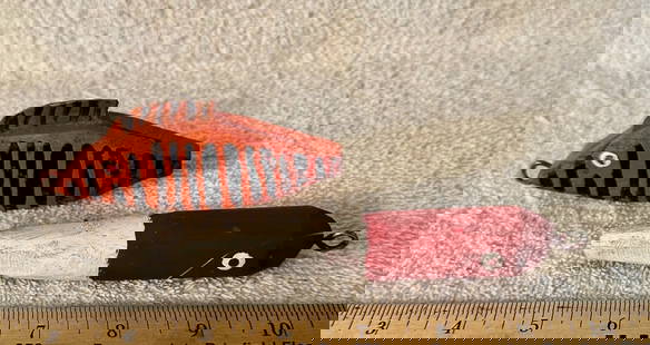 Painted Fishing Lure & Bobber Signed T Brown: An orange with black stripes whimsical fishing lure and a line bobber, painted red and white with round, googly eyes. Both are signed “T. Brown”. The lure has a painted-to-match tin dorsal