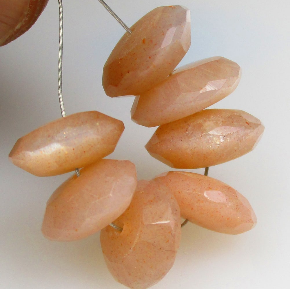 20.18 Ctw Natural 7 Drilled Moonstone Round Beads: No Reserve! Title: 20.18 Ctw Natural 7 Drilled Moonstone Round Beads Stone Clarity: Semi-Transparent Gemstones: Natural Moonstone Beads Carat Weights: 20.2 Size/Dimensions: 9.30 - 10.50 mm / 7 P'cs Ad