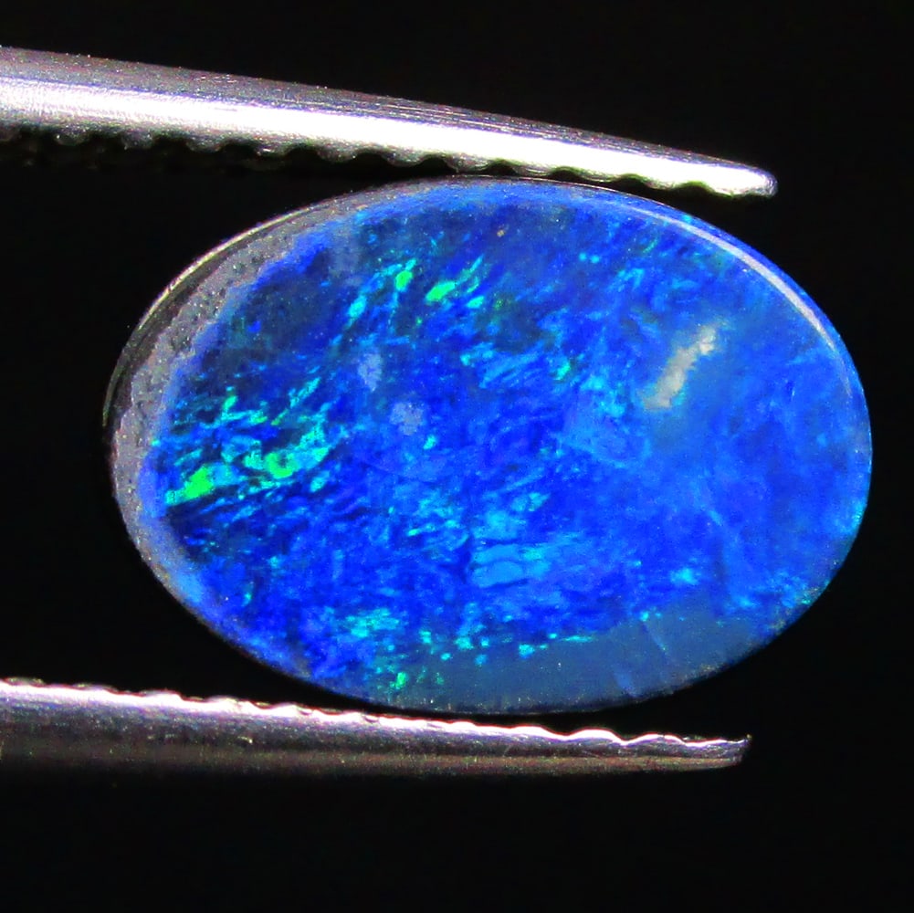 1.93 Ctw Natural Australian Doublet Opal Oval Cabochon: No Reserve! Title: 1.93 Ctw Natural Australian Doublet Opal Oval Cabochon Stone Clarity: Opaque Gemstones: Natural Australian Opal Carat Weights: 1.93 Size/Dimensions: 10.20 x 7.10 x 2.50 mm Additiona
