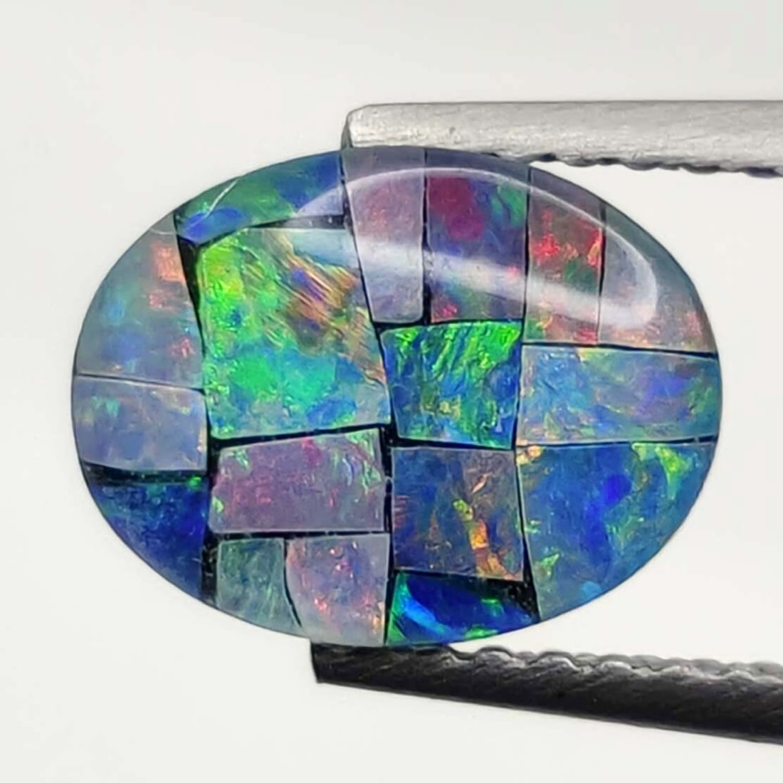 1.45 ct Australian Triplet Mosaic Opal: No Reserve! Title: 1.45 ct Australian Triplet Mosaic Opal Additional Information: Gemstones: Australian Doublet Opal Carat Weights: 1.45 ct Size/Dimensions: 9 X 7 mm Materials & Techniques: Doublet Op