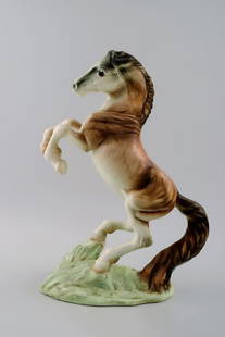 Large Goldscheider figure in porcelain, rearing horse.: Large Goldschneider figure in porcelain, rearing horse. Measures 32 x 22 cm. In perfect condition. Marked: Goldschneider, Made in England. Reserve: $469.00 Shipping:Domestic: Shipping rates are