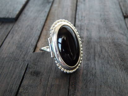 Natural Baltic Black Cherry Amber Adjustable Poison Ring: Title: Natural Baltic Black Cherry Amber Adjustable Poison Ring Additional Information: Adorn your gothic style with this exquisite natural Baltic black cherry amber poison ring. This timeless and sed