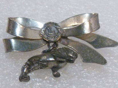 Vintage Sterling Silver Lions International Bow and Dangling Lion Charm Brooch, 1950's: Vintage Sterling Silver Lions International Bow Brooch with Dangling Lion Charm. Weight is 7.94 grams. This is 1.5" wide and about the same tall, including the lion. It is signed on the back but I can