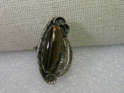 Sterling Silver Navajo Tiger's Eye Ring, with Feathers & Ornate Silver Work, Size 5.25, 6.16 grams: Vintage Jewelry: Vintage Sterling Silver Navajo Tiger's Eye Ring, Feather, Blossom and Ornate Silver Work, sive 5.25 and weight is 6.16 grams. This is approximately 1950-1960's. Beautiful Statement Ri