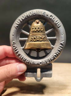 Good Roads Club License Plate Fob Topper: 5" tall x 3 3/4" wide Wonderful reproduction license plate topper. Good detail aluminum, slightly aged to look like an antique. Certainly hard to tell its age. Reserve: $28.00 Shipping:Domestic: