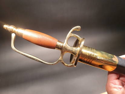 French Cutlass Hanger Sword French Indian War & Rev War: 43" Long with scabbard 38" overall 30 1/2" V blade 4" Wood handle Similar to the replica Antique English Hanger we offer, this piece is the French Hanger Replica c1730-1750 wood handle, solid brass so