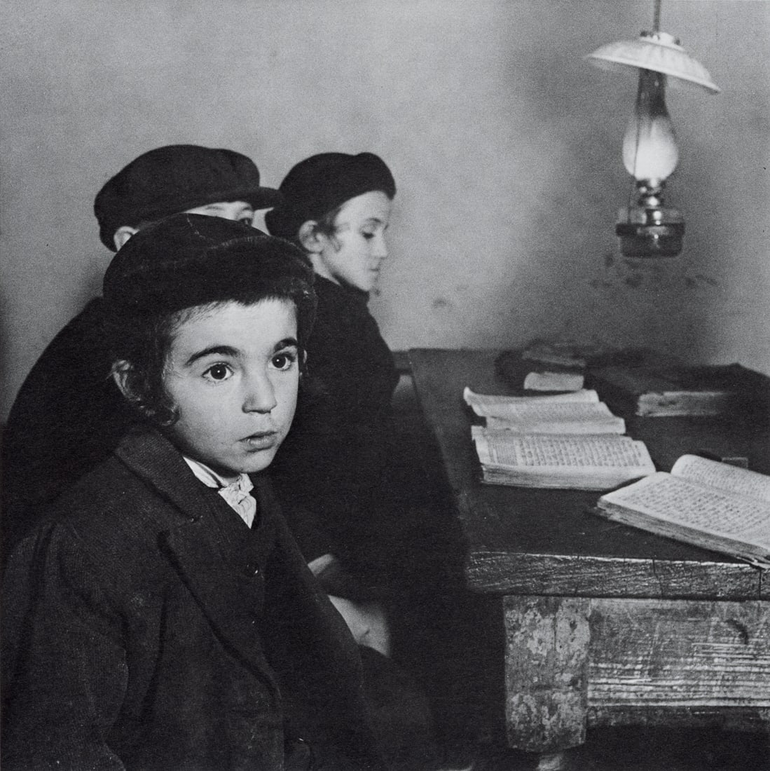 ROMAN VISHNIAC - Three Student School, Ruthenia, 1938: Artist: Roman Vishniac Title: Three Student School, Carpathaian, Ruthenia, 1938 Medium: Photo Litho, 1979, USA Dimensions: 6.05x6.05" Description: Heat Wax Mounted on 8.5x11" Conservation Board Artist