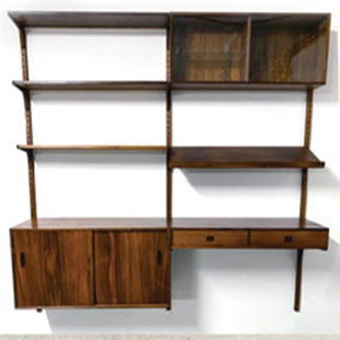 Nils Jonsson Shelving: Condition Excellent Original Condition Designer Nils Jonsson County of Manufacture Sweden Materials Rosewood Diemensions Height 185cm Width 253cm Deepest Depth 40cm (Cupboard and Doors) 