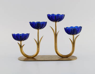 Gunnar Ander for Ystad Metall. Candlestick in brass and blue art glass shaped like flowers. 1950s.: Title: Gunnar Ander for Ystad Metall. Candlestick in brass and blue art glass shaped like flowers. 1950s. Description: Gunnar Ander for Ystad Metall. Candlestick in brass and blue art glass shaped lik