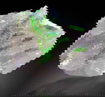 Damage Free Natural Green Tourmaline Crystals On Quartz: Treatment: None Condition: Natural Name: Tourmaline, Quartz Color: Green Weight: 1117 grams Size: 110x130x100 m.m Origin: Afghanistan Shape: Specimen Reserve: $1,500.00 Shipping: Domestic: F