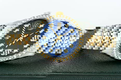 Rolex Mens Datejust 36 Steel and 18K Yellow Gold Blue Diamond Watch: BRAND : Rolex MODEL : Rolex Mens Datejust CASE MATERIAL : Stainless steel DIAL : Custom Blue Dial Set With 6 & 9 Diamond Markers and 8 Genuine Round Diamond Hour Markers. BEZEL : Custom 18K Yellow Gol