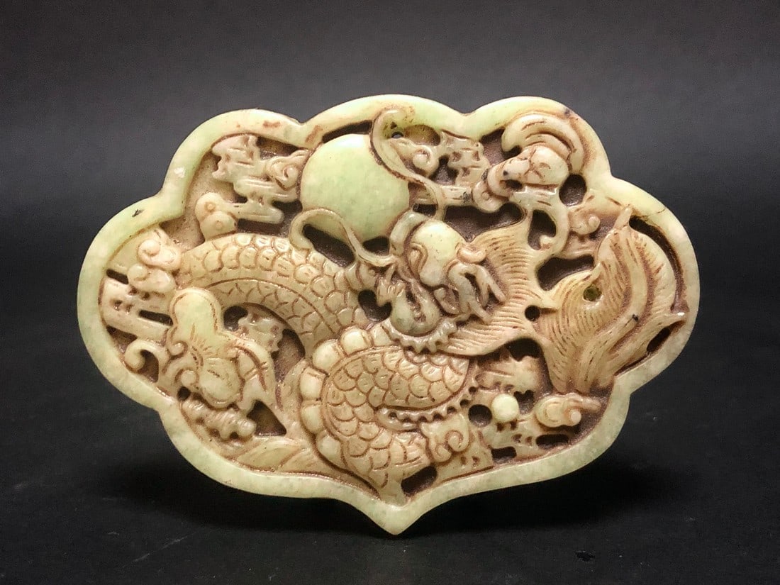 Old pendant with dragon and octopus natural jade - China: Old pendant with dragon and octopus natural jade - China. 9.2 x 6.5 cm, 91 gr. green natural jade. Condition: very good, small hairline at the right side due age. Reserve: $60.00 Shipping: Domestic: F