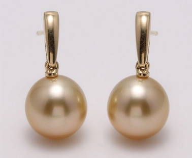 14 kt. Yellow Gold - 10x11mm Golden South Sea Pearls - Earrings: Title: 14 kt. Yellow Gold - 10x11mm Golden South Sea Pearls - Earrings Description: Produced by the gold-lipped Pinctada Maxima Oyster in the warm waters of Indonesia, these pearls have a natural magn
