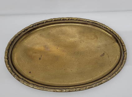 Vintage Brass Faux Bamboo Serving Tea Tray or Asian Oval Vanity Dresser: Vintage from the 1960s Materials: Metal Description Vintage Brass Faux Bamboo Serving Tea Tray or Asian Oval Vanity Dresser Tray Nice tray with heavy tarnish, can be polished or leave as is. The top e