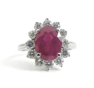 Oval Ruby Diamond Halo Cocktail Statement Ring 18K White Gold, 2.75 CTW: Oval Ruby Diamond Halo Cocktail Statement Ring 18K White Gold, 2.75 CTW Make a statement with this gorgeous ruby and diamond ring. Please let us know if you have any questions. Gemstone: 1 oval red ru
