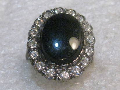 Vintage Sterling Black/Clear Halo Ring, size 5.75, 4.93 grams, 1" long: Vintage Sterling Silver Faux Onyx clear rhinestone halo. This is a size 5.75. It is 1" long and 3/4" wide. It has a slightly tiered design. It is marked sterling inside the band and tested too. Weight