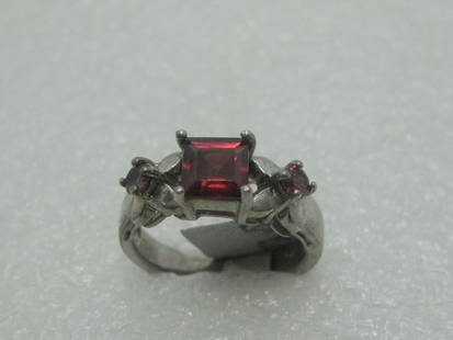 Silver Simulated Ruby Ring, Size 7, square stone, X design: Simulated Ruby Ring, size 7, Silver, marked .925 and tested as .925. This has a center square stone that is 5.9mm across and two round stones that are appx. 3mm across. There are X designs at each of