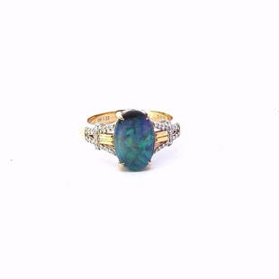 Estate $2200 18K Yellow Gold Australian Black Opal Diamond Ring: Title: Estate $2200 18K Yellow Gold Australian Black Opal Diamond RingDescription: Estate 18K Yellow Gold Australian Black Opal Diamond Ring Ring size 7 Ring top measures 1/2" x 5/16" Ring