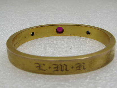 Victorian 10kt Ruby & Diamond Hinged Bangle Bracelet 7". LMR Engraved: Victorian 10kt Ruby & Diamond Hinged Bangle Bracelet 7". Monogrammed LMR on the opposite side from the stones. 8.5mm wide. It is marked on the inside slide and signed but cannot make out the mark.