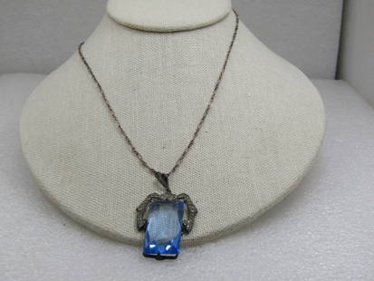 Vintage Sterling Blue Czech Glass & Rhinestone Necklace, 18".: Vintage Sterling Blue Czech Glass & Rhinestone Necklace, 18". It has a large blue Czech glass step cut stone int he pendant that is appx. 1.25" long and 3/4" wide. It is being held by a swag-like uppe