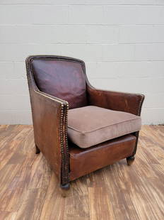 Art Deco French Distressed Brown Lounge Chair: Vintage from the 1930sMaterials: leather, wood, metal Description: Art Deco French Distressed Brown Lounge Chair The Lounge is being offered “As Is” with it’s original distressed