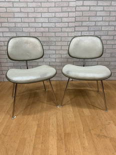 Mid Century Modern Eames for Herman Miller DCM Chairs Newly Upholstered - Pair: Vintage from the 1970sMaterials: leather, steel, plastic, chrome, metal Description: Mid Century Modern Eames for Herman Miller DCM Side Chairs Newly Reupholstered in High End Pearl White Leather -