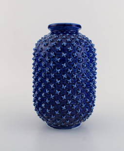 Gunnar Nylund for R&#246;rstrand. Chamotte vase in glazed ceramics with spiky surface. Beautiful: Gunnar Nylund for R&#246;rstrand. Chamotte vase in glazed ceramics with spiky surface. Beautiful glaze in shades of blue. 1950s. Measures: 22 x 14 cm. Stamped. In excellent condition. Reserve: $413.00