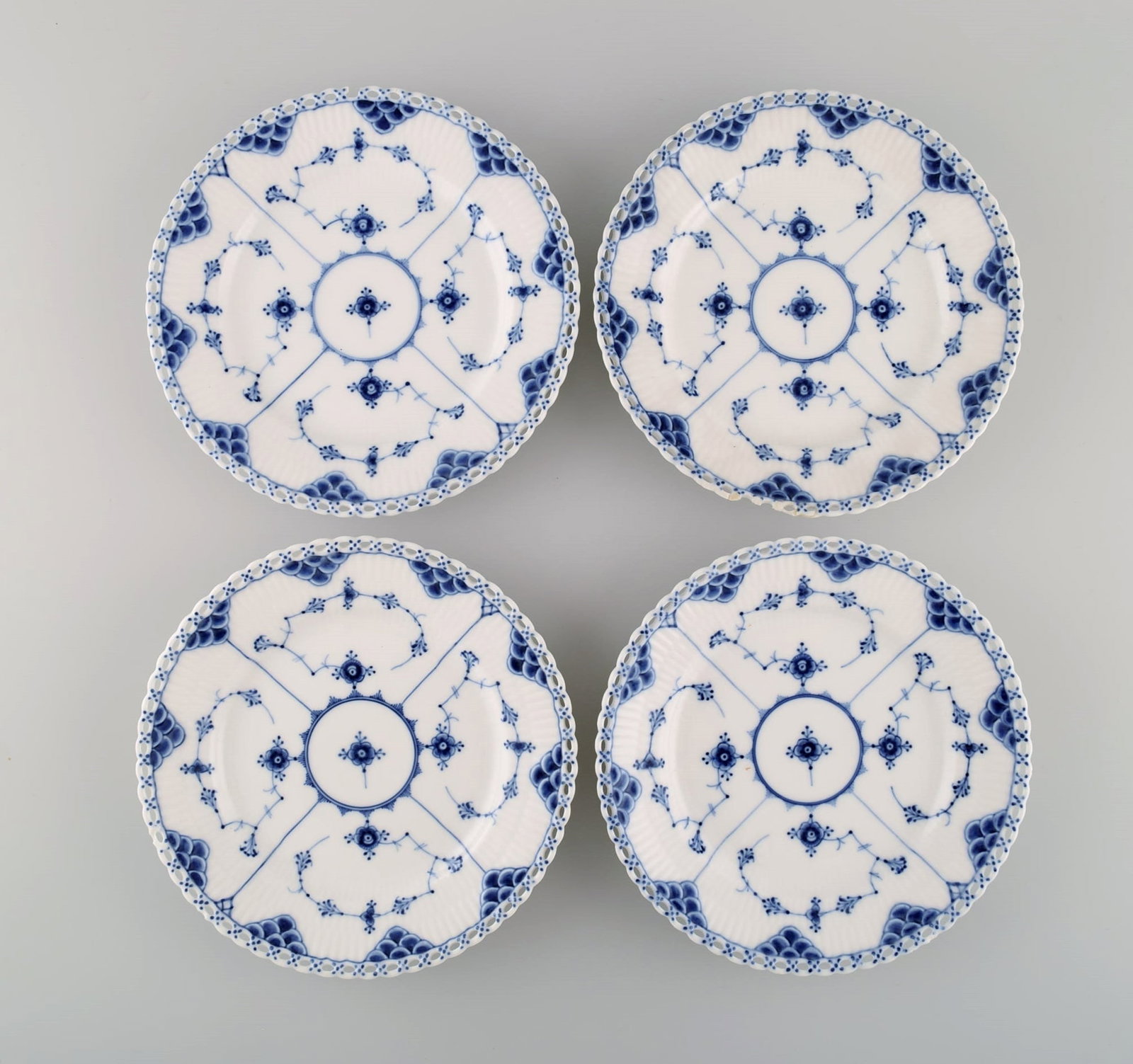 Four antique Royal Copenhagen Blue Fluted Full Lace plates. 19th century.: Four antique Royal Copenhagen Blue Fluted Full Lace plates. 19th century. Diameter: 20 cm. In good condition. All plates with small chips. 1st factory quality. Stamped. Reserve: $140.00 Shipping: Dome
