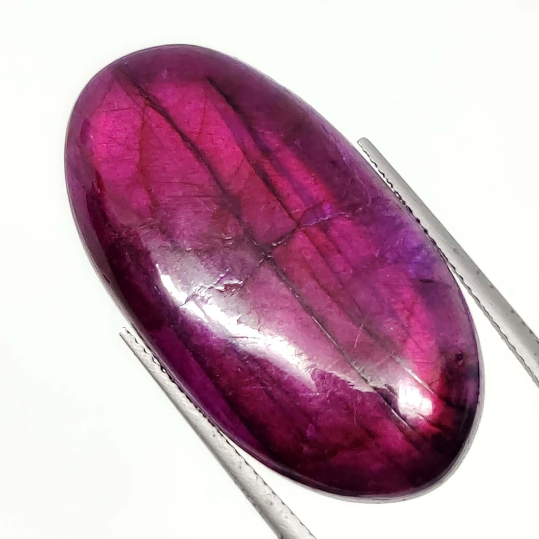 39.55 Ct "Stunning" Purple Fire Labradorite: No Reserve! Title: 39.55 Ct "Stunning" Purple Fire Labradorite Additional Information: Gemstones: Natural Labradorite Carat Weights: 39.55 ct Size/Dimensions: 35 X 19 X 7 mm Treatment: Color Dyed Mate