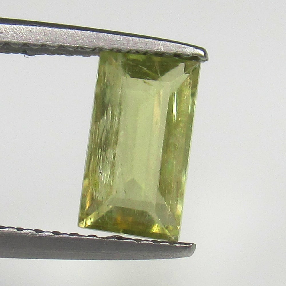 Natural Diaspore- 1.44 Ct: No Reserve! Title: Natural Diaspore- 1.44 Ct Origin: Turkey Weight: 1.44 Size/Dimensions: 8.8 x 5.0 x 3.2 mm Additional Information: Pieces : 1 No's / Shape : Octagon Cut / Color : Yellow / Clarity : 
